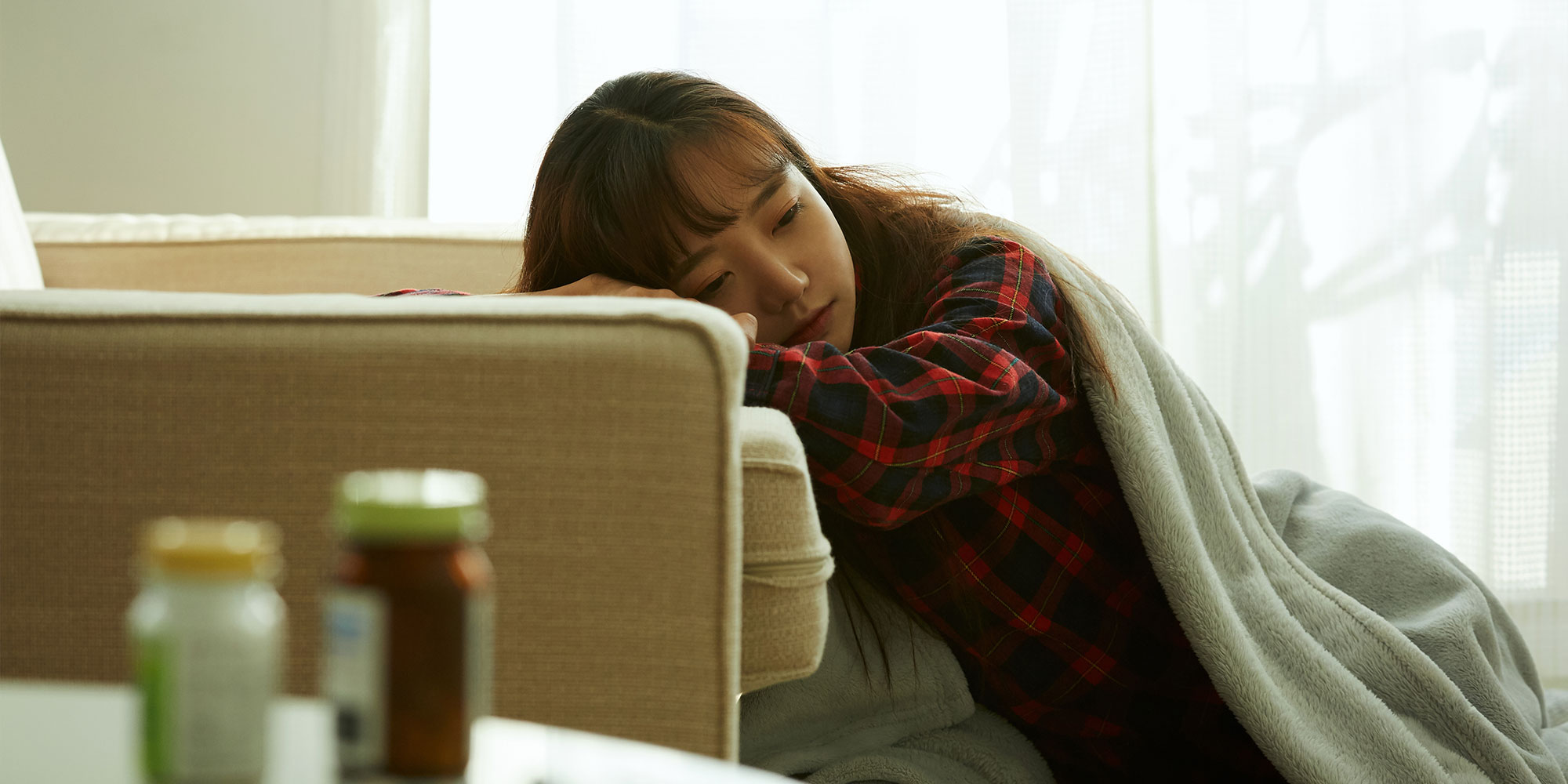 体調不良の女性